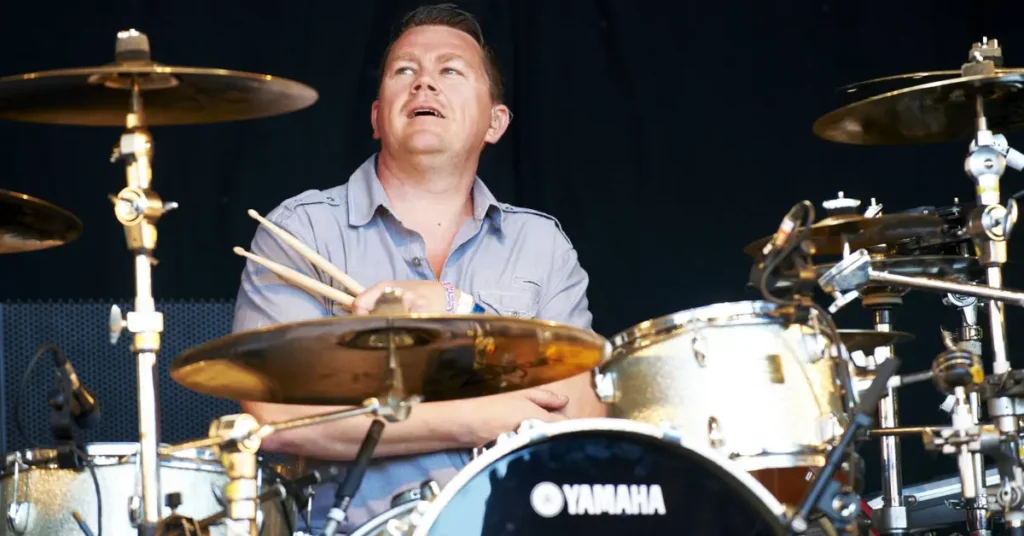 Nick Banks: The Drummer Who Held the Beat